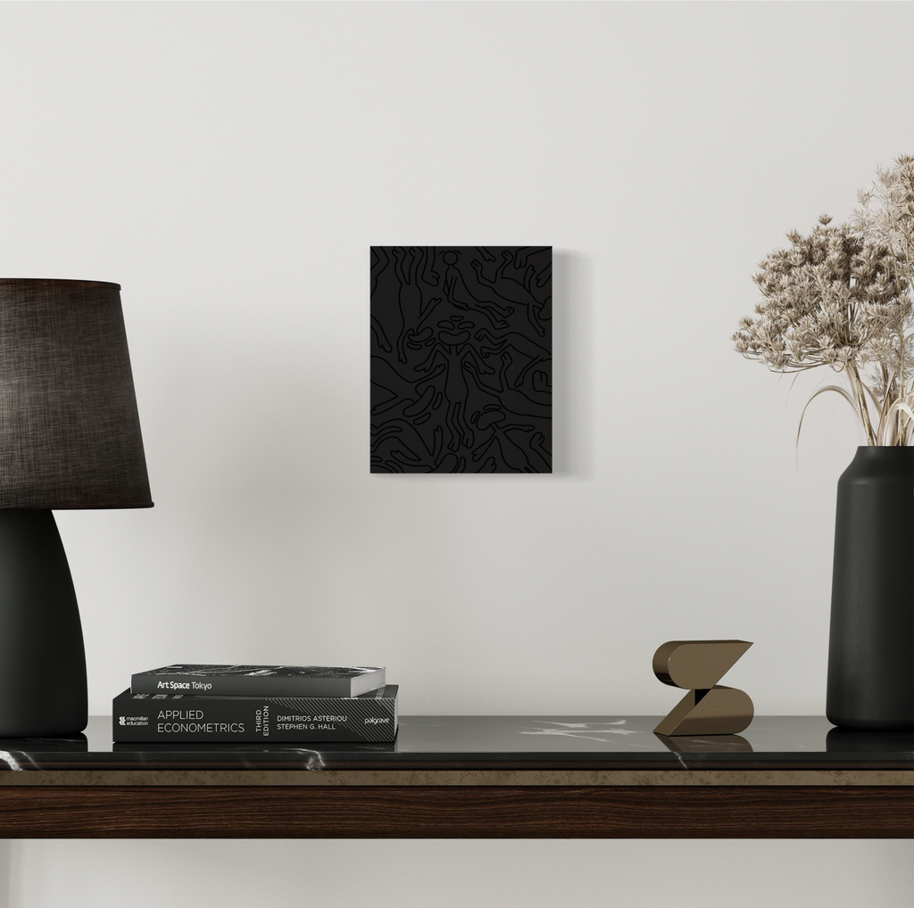 This piece gives the emotion of a black void with characters drawn in black outline falling into it, This represents Yin dark passive and cold. hung on wall with background 