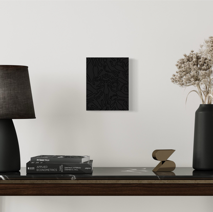 This piece gives the emotion of a black void with characters drawn in black outline falling into it, This represents Yin dark passive and cold. hung on wall with background 
